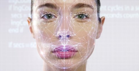 Futuristic and technological scanning of the face of a beautiful woman for facial recognition and scanned person. It can serve to ensure personal safety. Concept of: future, security, scanning.