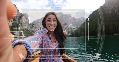 in the middle of lake, on holiday, a girl uses a mobile phone or smartphone for futuristic video calls. She call a friends and family from home. Concept:holiday,technology,love,future