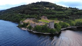 Flight around Urquhart Castle and Loch Ness in the evening - aerial drone footage