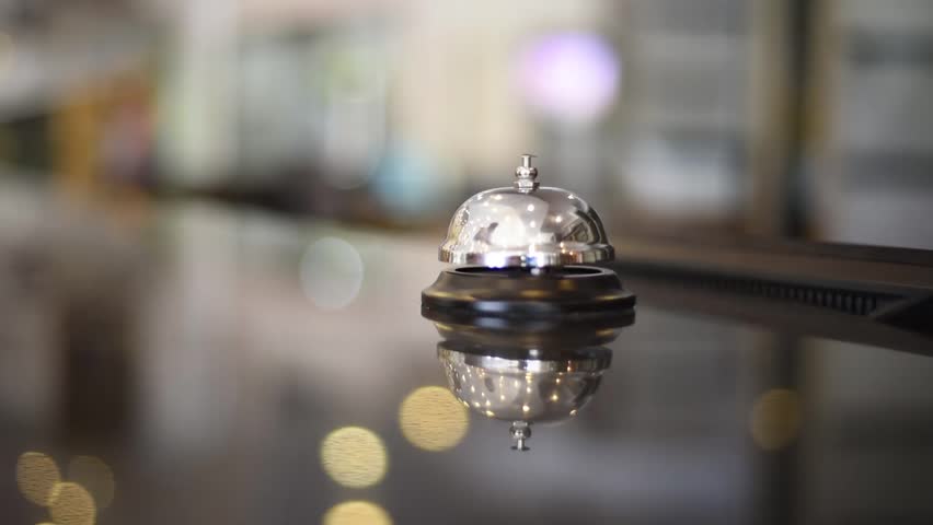 Bell on reception at the hotel to call the administrator. Beautiful blurred background. The hand of the man who presses the call. Close up. Cool concept for hotels. Filmed in July 2018. Royalty-Free Stock Footage #1014108881