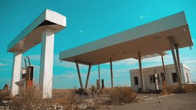 Old dirty deserted gas station lifestyle. U.S. Route 66. crisis road 66 fueling slow motion video. closed supermarket store shop Abandoned gas station oil end of fuel the world apocalypse petrol.