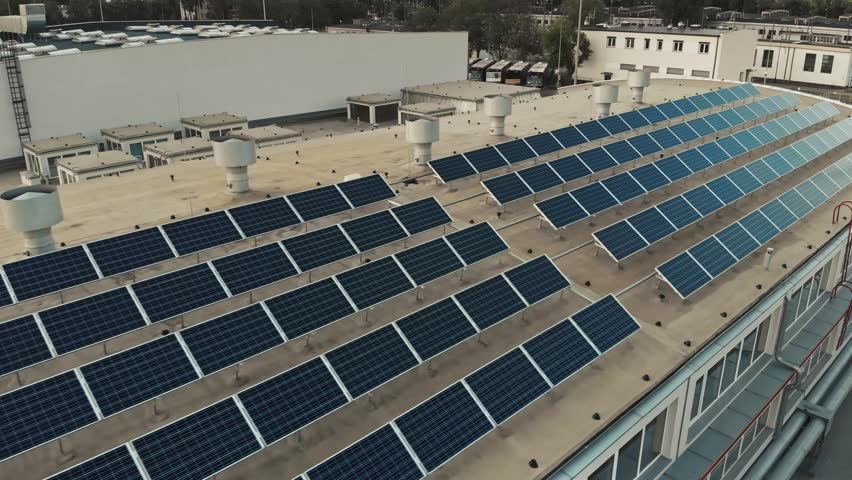 Solar Panels installation on the commercial building roof. Green and clean power from the sun. Royalty-Free Stock Footage #1014120206