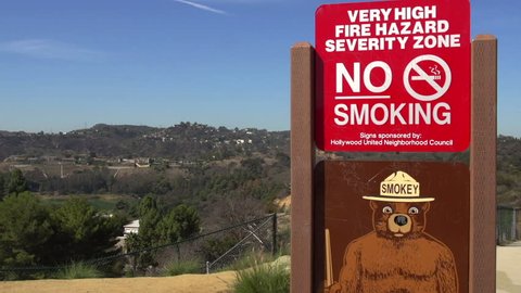 Los Angeles, California / USA - September 17, 2016: Smokey the Bear Fire Hazard Sign Over Canyons of Hollywood, California.