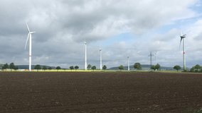4K footage of wind power turbines generators in the field of Germany