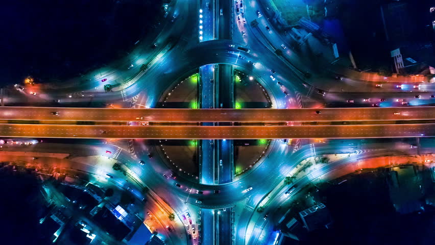 Aerial shot top view circle road Traffic in city at night, 4K, time lapse, bangkok , thailand. Royalty-Free Stock Footage #1014126020