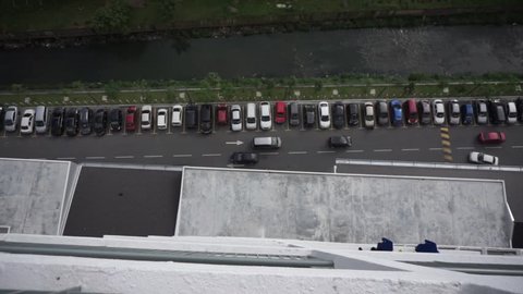 Looking down from level 30, looks like a parking and moving vehicle.