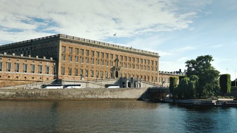Stockholm, Sweden, July 2018: The Royal Palace in Stockholm. A clear summer day, a number of tourist buses are parked nearby