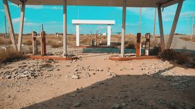 main street of america. Route 66. crisis road 66 fueling broken window slow motion video. Old dirty deserted gas station. U.S. closed supermarket store shop Abandoned gas station oil end of fuel the