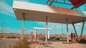 Route 66. crisis road 66 fueling slow motion video. Old dirty deserted gas station. U.S. lifestyle closed supermarket store shop Abandoned gas station oil end of fuel the world apocalypse petrol. main