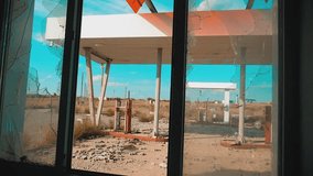Route 66. lifestyle crisis road 66 fueling broken window slow motion video. Old dirty deserted gas station. U.S. closed supermarket store shop Abandoned gas station oil end of fuel the world
