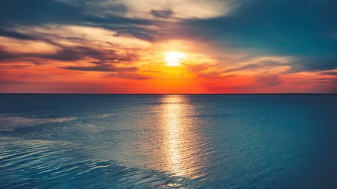 Panorama of sea sunset, ocean sunrise, seascape. Beautiful serene scene. Nature landscape. Holidays, travel, vacation. Water waves movement and clouds in sky float. 4K Slow Motion Time Lapse Parallax