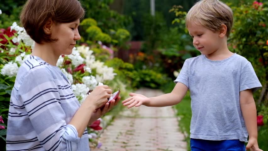 Child Hygiene. Woman cleaning child