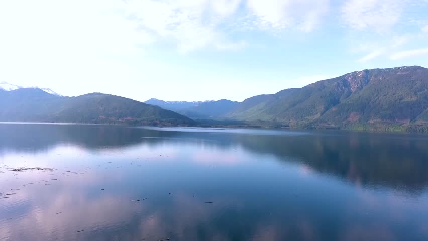 Aerial pan overlooking beautiful Harrison lake from camp ground in nature