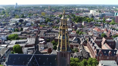 Aerial footage turning camera around the Aa-kerk tower this church is historic parish church in centre of Groningen and dominant feature in skyline of the city together with the nearby Martinitoren