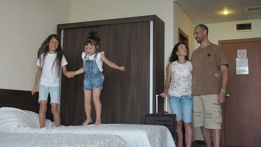 Family Hotel Room Happy Children Jumping Stock Footage Video (100% ...