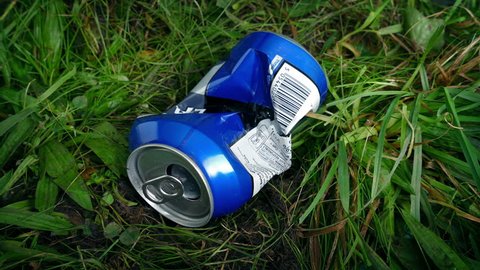 Can Thrown in Grass - Litter Concept