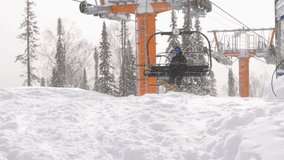 Snowboarder comes from the ski lift