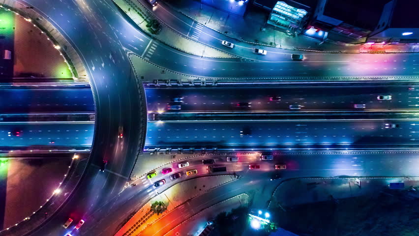 Aerial shot top view circle road Traffic in city at night, 4K, time lapse, bangkok , thailand. Royalty-Free Stock Footage #1014188483