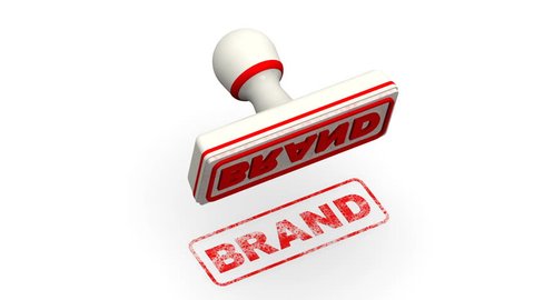 Brand. The stamp leaves a red imprint BRAND (a type of product manufactured by a particular company under a particular name) on white surface. Footage video