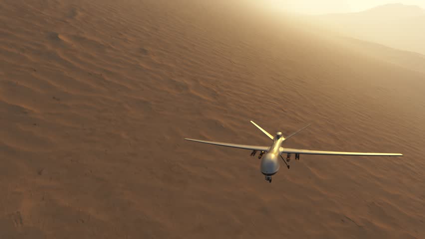 03593 Military predator drone flying over desert and mountains. Camera is fixed to drone.
