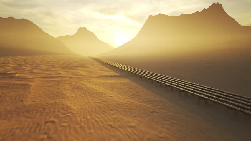 03583 Five streams of pipeline with heat-pipes running through a desert with mouintains in background.