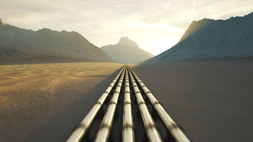 03578 Five streams of pipeline running through a desert with mouintains in background.