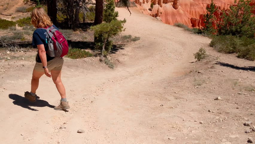 Woman hiking in the Badlands of South Dakota