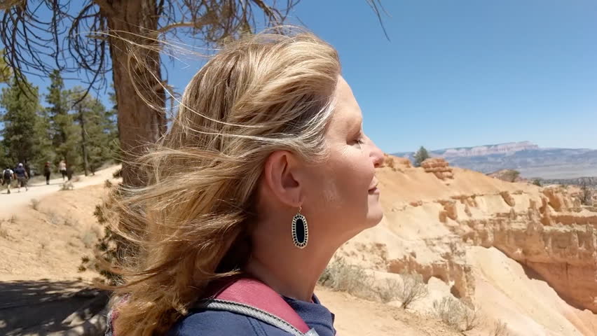 Mature woman taking in the beauty of the Badlands of South Dakota
