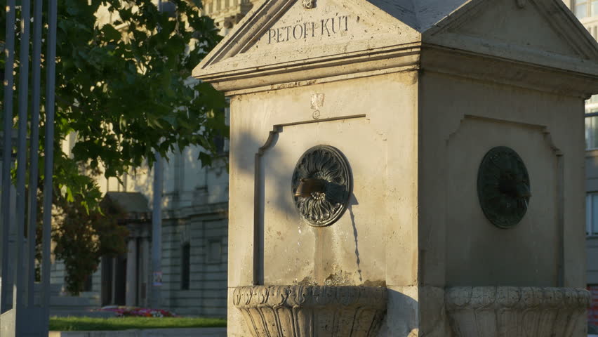 Stone old public fountain with fresh water in Budapest, Hungary.
