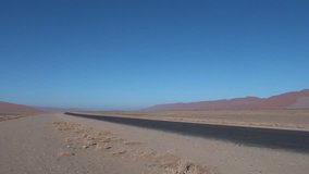 HD high quality video of red sand dunes and barchans in famous endless sand sea area of Sossusvlei Namib Desert on sunny early morning in Namib-Naulkuft Park in Namibia, southern Africa