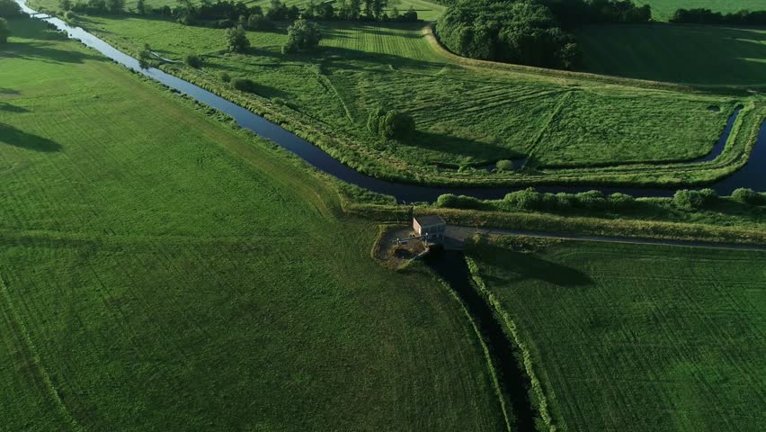 Aerial view of a pump house at a river