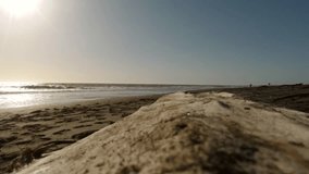 Jogger followed by a recording Drone on a lonely sand beach at sunset wilth light reflection on the sea surface - Powered by Shutterstock - Get 15% off with code: PIKWIZARD15