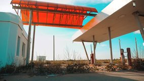 main street of america. Route 66. crisis road 66 fueling slow motion video. Old dirty deserted gas station. U.S. closed supermarket store shop Abandoned gas station oil end of lifestyle fuel the world