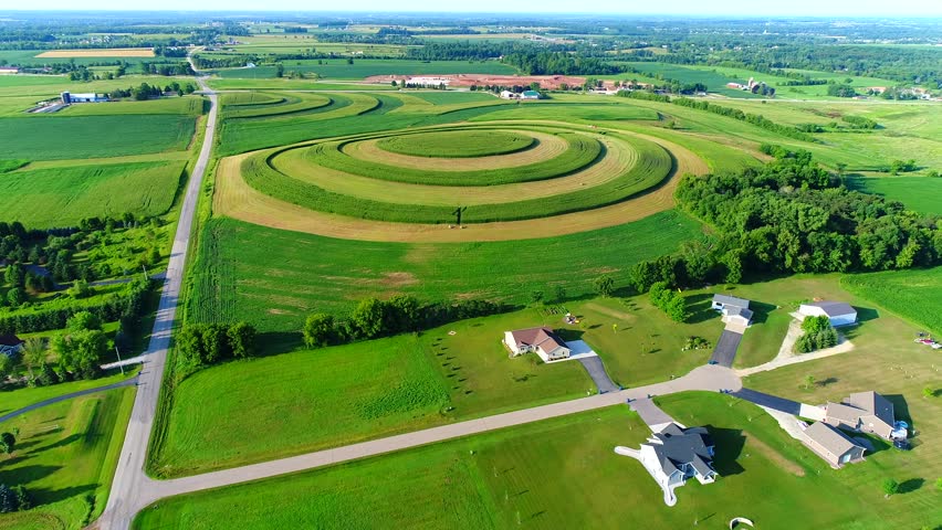 Strip farming on hilltop fights erosion and looks like crop circles.
