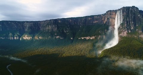 8th natural wonder of the world. Drone makes panning about the highest waterfall in the world, Angel Falls in the middle of the beautiful light of the jungle. Canaima National Park, Venezuela