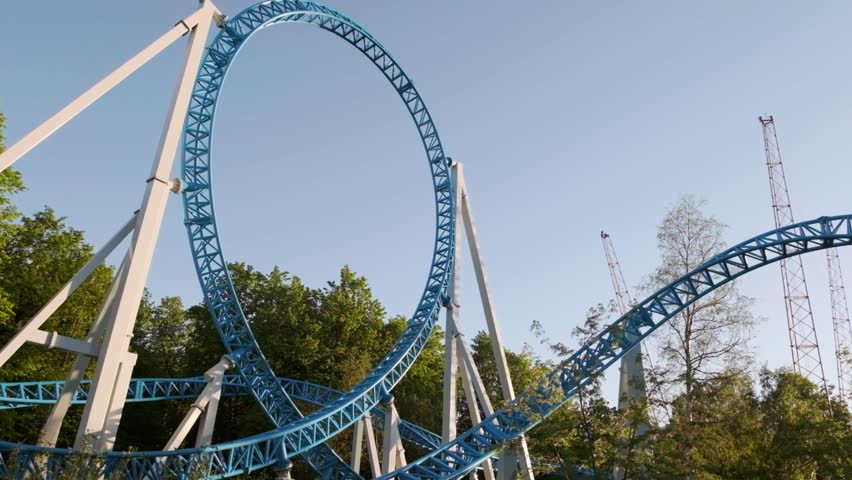 POV riding roller coaster at amusement park. Children on ride at ...