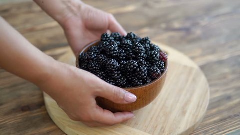 Womans Hand Put Bowl Blackberries On Stock Footage 100 Royalty Free 1014296312 Shutterstock Bowl Blackberries On Stock Footage, What To Put In Bowl On Table