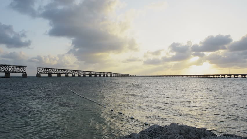 Sunset dark evening clouds in Bahia Honda State Park, Florida Keys, with old bridges, ocean and gulf of mexico, slow motion