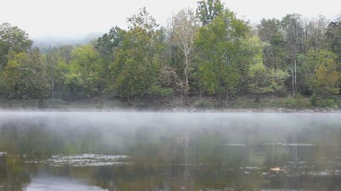 New River Gorge water, river, lake during autumn, fall by Grandview with peaceful calm tranquil morning mist fog, bird sounds, foliage