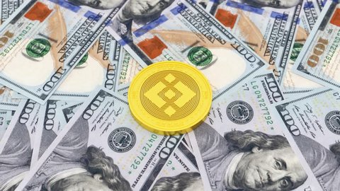 Binance Coin on dollars - BNB - 3D Cryptocurrency Coin Loop animation. 4K Full HD binance Coin Animation. High Resolution Binance Coin Animation on Dollars Background.