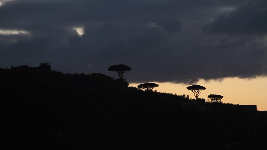 Amalfi coast, Italy, sunset in Sorrento. Sea waves, rocks and sun light. Mediterranean sea.
