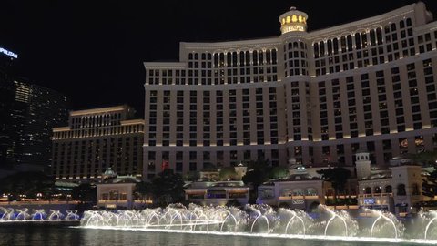 Las Vegas, Nevada - April 2018: Bellagio water fountain show in Las Vegas with original ambient sound. Fountains of Bellagio. 4k video with panoramic shooting and ambient sound.