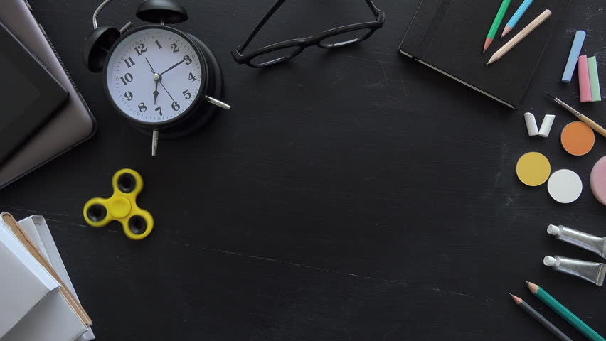 Teacher writing Albert Einsteins physical formula on school blackboard