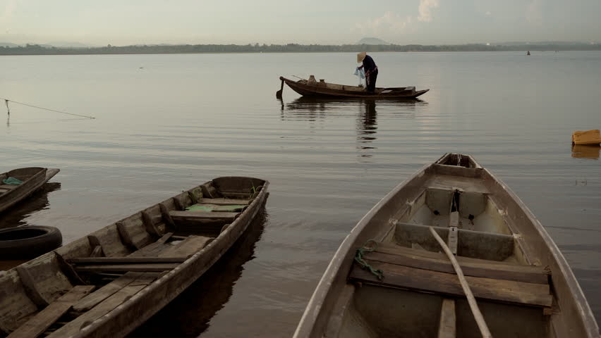 Fishermen are fishing with nets.
