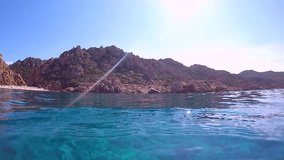 Underwater shot of young woman swimming in clear blue water enjoying vacations in beautiful place. Shot in Sardinia, Italy, Europe.
Travel fun concept shot in 1080 HD format Slow motion