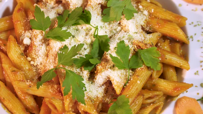 Rotating Shot Pasta Penne with Tomato Bolognese Sauce, Parmesan Cheese and Basil