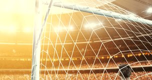 Goalkeeper fails to save from a goal on a professional soccer stadium while the sun shines. Stadium and crowd are made in 3D and animated.