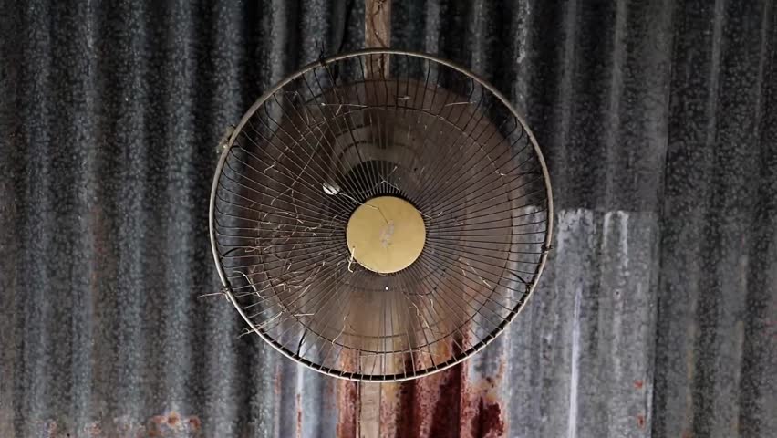 A old fan soeed rotate on metal roof.
