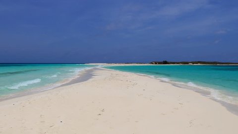 A tropical beach with a white sandbank connecting two islets in Cayo de Agua (Los Roques Archipelago, Venezuela).