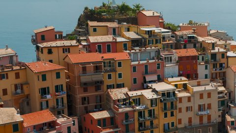 Telephoto close-up shot of the village of Manarola in Cinque Terre, Liguria, Italy, a UNESCO World Heritage Site, famous for its coastline, five villages and surrounding hillsides